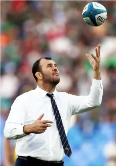  ?? — Reuters Photo ?? Michael Cheika throws a ball in the air before the match.