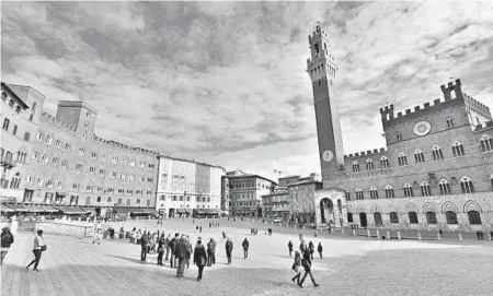  ?? CAMERON HEWITT/RICK STEVES’ EUROPE ?? Siena’s main square and gathering place is Il Campo. The great shell-shaped piazza features a sloped redbrick floor fanning out from the City Hall tower.