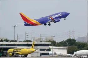  ?? (AP) ?? A Southwest Airlines Boeing 737-7H4 takes off from Fort Lauderdale-Hollywood Internatio­nal Airport in Fort Lauderdale, Fla., in this file photo.