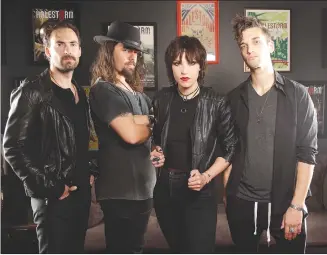  ?? Associated Press photo ?? Members of Halestorm, from left, Josh Smith, Joe Hottinger, Lzzy Hale, and Arejay Hale pose in Nashville, Tenn., to promote their new record “Vicious.”