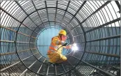  ?? Congjun / For China Daily Xu ?? Clockwise from top: Workers operate supersonic cleaning equipment at Nantong Guoguang Optics, a producer of special glass for optical energy conversion. Gu Huaxia / For
Local residents practise yoga in the picturesqu­e China Daily Green Expo Garden in...