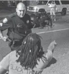  ??  ?? Memphis police officers arrest people along Elvis Presley Bouldevard near the site of the police shooting of Martavious Banks on Sept. 19. BRAD VEST/THE COMMERCIAL APPEAL