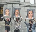  ?? STEPHANIE KEITH/GETTY IMAGES ?? Protesters hoist photos of financier Jeffrey Epstein outside federal court Monday in Manhattan.