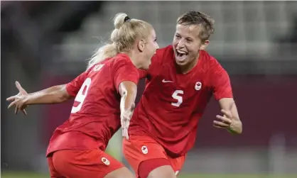  ?? Photograph: Fernando Vergara/AP ?? Quinn (right) celebrates with Adriana Leon after a Canada goal against Great Britain earlier in their Olympic campaign.