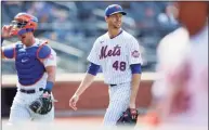  ?? Sarah Stier / Getty Images ?? The Mets’ Jacob deGrom looks on after coming off the mound during the eighth inning against the Marlins at Citi Field on Saturday.