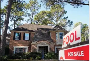  ?? (AP/Houston Chronicle/Melissa Phillip) ?? A real estate sign marks a home for sale recently in Houston.