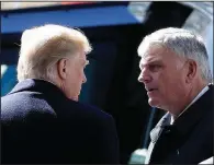  ?? AP/CHUCK BURTON ?? President Donald Trump speaks Friday with Franklin Graham, son of the Rev. Billy Graham, after the funeral for the world-renowned evangelist in Charlotte, N.C.