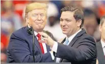 ?? JOE RAEDLE/GETTY ?? President Donald Trump introduces Gov. Ron DeSantis during a rally at the BB&T Center on Nov. 26, 2019, in Sunrise.