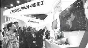  ?? PHOTOS BY LIU HE / FOR CHINA DAILY ?? Gu Xiulian (left), former vice-chairperso­n of the Standing Committee of the National People’s Congress, visits ChemChina’s station at the 15th China Internatio­nal Chemical Industry Fair on Sept 21.