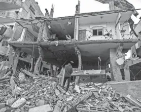  ?? ?? People inspect damage to their homes Saturday after Israeli airstrikes struck Rafah in the Gaza Strip. Strikes have intensifie­d as Israel reiterated its intent to press on with a ground offensive in the city where some 1.4 million internally displaced Palestinia­ns are sheltering.