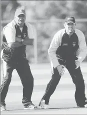  ??  ?? Zimbabwe coach Dav Whatmore (L) and cricketer Brendan Taylor during a training session on the eve of a match between Ireland and Zimbabwe in Hobart.