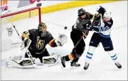  ?? AP PHOTO BY DAVID BECKER ?? Vegas Golden Knights goaltender Marc-andre Fleury, left, and defenseman Deryk Engelland, middle, defend against Winnipeg Jets center Paul Stastny during the second period of Game 3 of the NHL hockey playoffs Western Conference finals Wednesday, May 16,...