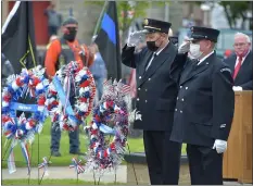  ?? PHOTOS BY PETE BANNAN - MEDIANEWS GROUP ?? Collingdal­e firefighte­rs salute after placing wreaths honoring the dead during the annual Memorial Day ceremony.