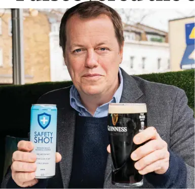  ?? ?? Cheers: Tom Parker Bowles armed with a can of Safety Shot and a pint of Guinness