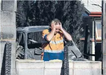  ?? Photo: JOSEPH JOHNSON/FAIRFAX NZ ?? Big loss: David Boyer looks at the destructio­n of his garage, three vehicles and a motorbike.