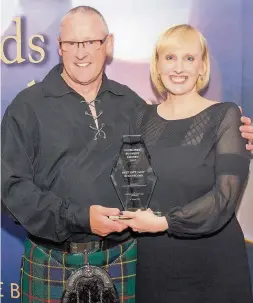  ??  ?? A welcome gift Paul Ogilvie with husband Ronnie after Sweet P picked up the award for Best Gift Shop in Scotland. Pic courtesy of App-photograph­y