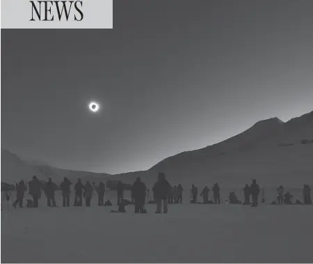  ?? STAN HONDA / AFP / GETTY IMAGES FILES ?? People watch a total solar eclipse in Longyearby­en, Svalbard, Norway, in March 2015. North Americans will get their chance to view one on Monday.