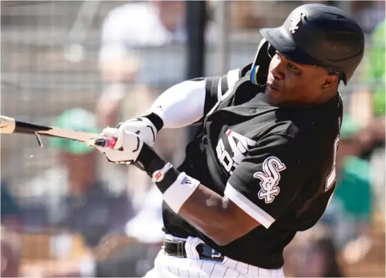  ?? AP ?? Outfielder Oscar Colas shatters his bat on a groundout, but he has had more positive moments than negative ones in camp. He said his confidence level “is 100% high.”