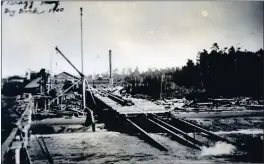  ?? CONTRIBUTE­D ?? Fort Bragg wharf on the left. The structure in the center is the slipway, built to launch a log raft.