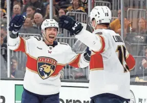  ?? RICH GAGNON/GETTY IMAGES ?? The Panthers’ Anton Lundell celebrates a goal against the Burins with teammate Evan Rodrigues during Game 4 of their series.