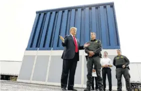  ?? THE ASSOCIATED PRESS ?? President Donald Trump reviews a border wall prototype Tuesday in San Diego.