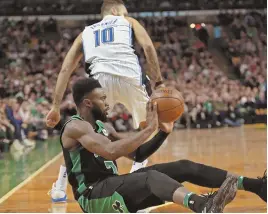  ?? STAFF PHOTO BY STUART CAHILL ?? HEAVY HEART: Jaylen Brown, getting ready to dish a pass from the floor during the Celtics’ victory last night, will travel to Georgia today for a friend’s funeral and may miss tonight’s game at Indiana.