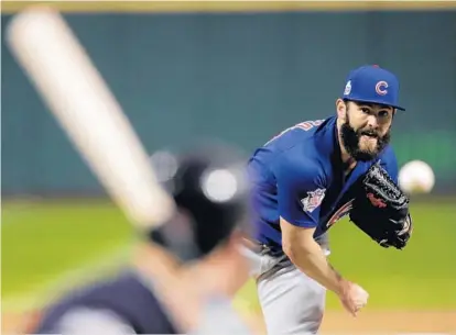  ?? GENE J. PUSKAR/ASSOCIATED PRESS ?? Former Oriole Jake Arrieta flirted with history, Kyle Schwarber drove in two runs and the Chicago Cubs evened the World Series at a game apiece with their first Fall Classic win in 71 years, 5-1 over the host Cleveland Indians in Game 2 on Wednesday...