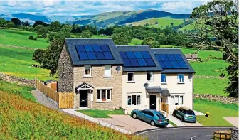  ??  ?? Eco appeal: New cottages with solar roof panels in Kendal, Cumbria