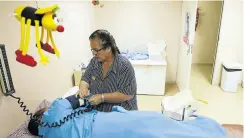  ?? Picture: Phill Magakoe ?? Marti Dewrance, a nurse at Reproducti­ve Choices Clinic in Midrand, checks a patient’s blood pressure.