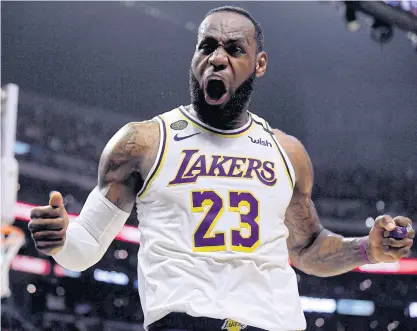  ??  ?? The Lakers’ LeBron James celebrate during a game this month.