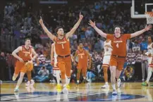  ?? AP photo ?? Clemson’s Chase Hunter (1) and Ian Schieffeli­n (4) celebrate after the Tigers’ 77-72 victory over Arizona in the Sweet 16 on Thursday.