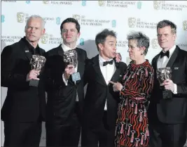  ??  ?? The Associated Press From left, director Martin Mcdonagh, producer Peter Czernin, actors Sam Rockwell and Frances Mcdormand, and producer Graham Broadbent backstage with their awards for “Three Billboards Outside Ebbing, Missouri” at the BAFTA 2018...