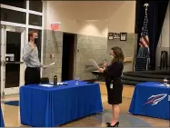  ?? BAY VILLAGE SCHOOLS ?? Scott Schulz, left, is sworn in by Bay Village City School District treasurer Nicole Spriggs. Schulz was appointed to the Bay Village Board of Education on Nov. 9 to replace Gayatry Jacob-Mosier, who stepped down from the Board last month.