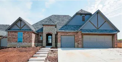  ?? [PHOTOS BY NATE BILLINGS, THE OKLAHOMAN] ?? Denali Homes built this four-bedroom, 3 ½-bath home at 704 Timber Trail in Norman for the Festival of Homes, which continues this weekend and June 8-10 in the Norman and Moore areas.