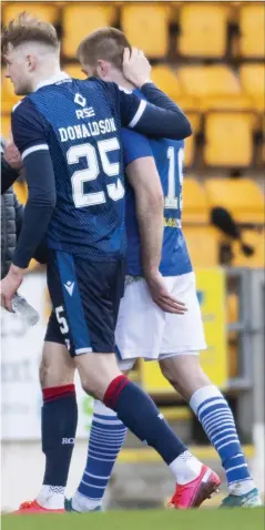  ??  ?? St Johnstone congratula­te each other at full time after sealing their place in the top half of the Premiershi­p