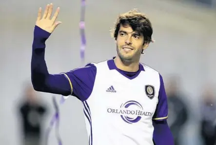  ?? RICARDO RAMIREZ BUXEDA/STAFF PHOTOGRAPH­ER ?? Orlando City midfielder Kaká shows off the team’s new away jersey to fans during an open training session Tuesday at the Citrus Bowl.
