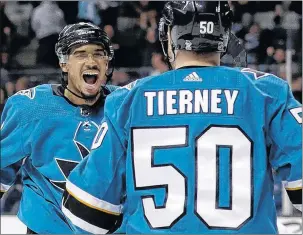  ?? AP PHOTO ?? San Jose Sharks’ Evander Kane celebrates his goal with teammate Chris Tierney during Saturday’s NHL game against the Calgary Flames in San Jose, Calif.