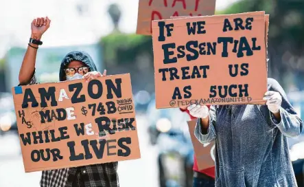  ?? Valerie Macon / Getty Images ?? Workers protest for adequate protection­s in the workplace from COVID-19 at an Amazon delivery hub in Hawthorne, Calif., on the National May Day Walkout/Sickout.