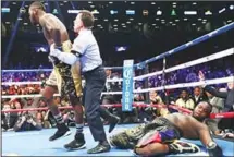  ??  ?? Deontay Wilder knocks out Bermane Stiverne in the first round during their rematch for Wilder’s WBC heavyweigh­t title at the Barclays Center on Nov
4, in the Brooklyn borough of New York City. (AFP)