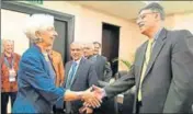  ?? AFP ?? IMF managing director Christine Lagarde (left) greets Pakistan finance minister Asad Umar in Bali.