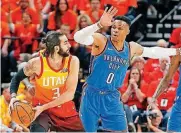  ?? [AP PHOTO] ?? Oklahoma City’s Russell Westbrook, right, guards Utah’s Ricky Rubio during Saturday night’s loss in Salt Lake City. Utah won the game to take a 2-1 lead in the best-of-7 series.