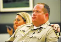  ?? Erik Verduzco ?? Las Vegas police officer Jeremy Robertson with his wife, Melissa, during the sentencing hearing Thursday for Clemon Hudson and Steven Turner at the Regional Justice Center.
Las Vegas Review-journal @Erik_verduzco