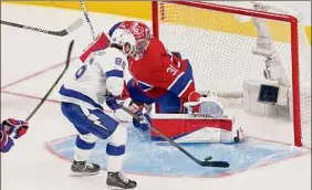  ?? Andre Ringuette / Getty Images ?? Nikita Kucherov of Tampa Bay scores against Carey Price of Montreal during the second period in Game 3 of the Stanley Cup Final on Friday.
Associated Press