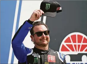  ?? Charles Krupa / Associated Press ?? NASCAR Cup Series driver Kurt Busch tips his cap before a NASCAR Cup Series race July 17 at the New Hampshire Motor Speedway in Loudon, N.H. Busch announced Saturday he will miss the rest of this season with a concussion and will not compete full-time in 2023. The 44-year-old made his announceme­nt at Las Vegas Motor Speedway, his home track and where he launched his career on the bullring as a child. He choked up when he said doctors told him “it is best for me to ‘shut it down.’ ”