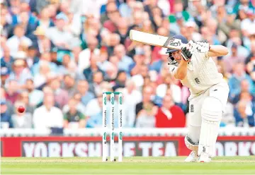  ?? — AFP photo ?? England’s Jos Buttler plays a shot during play on the second day of the fifth Test cricket match between England and India at The Oval in London on September 8, 2018.