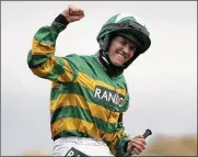  ?? SCOTT HEPPELL PHOTOS/AP POOL ?? Rachael Blackmore riding Minella Times celebrates after winning the Randox Grand National Handicap Chase Saturday.