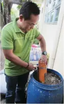  ??  ?? VERMITEA BREWER – Ranison Narciso, Solsona municipal agricultur­e officer, checks the brewer used in producing vermitea which is sprayed on the leaves of plants so they grow faster. Sprayed plants are also more resistant to pests and diseases.