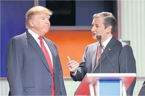  ?? AFP ?? Republican presidenti­al candidates Donald Trump, left, and Senator Ted Cruz, a Republican Senator for Texas, speak during a commercial break in the Fox Business Network Republican presidenti­al debate.