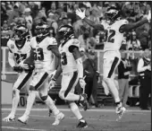  ?? Associated Press ?? GAME OVER Eagles outside linebacker Nigel Bradham (53) and teammates celebrate his intercepti­on in the last minute of the team’s 34-27 win against the Packers on Thursday.