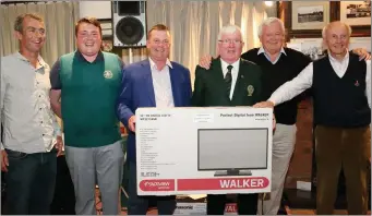  ??  ?? The winners of the Greenore Golf Classic - Shane Leatham, John McCormack, Dean Mulligan and Gary Leatham - receive their prizes from the sponsors Laurence Dunne (Bellurgan Service Station) and Eugene Duffy (Eugene Duffy Constructi­on) at the presentati­n...